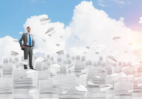 Confident Businessman Suit Standing Flying Paper Planes Looking Away Cloudly — Stock Photo, Image