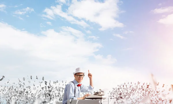 Young Man Writer Hat Eyeglasses Using Typing Machine Pointing Upside — Stock Photo, Image