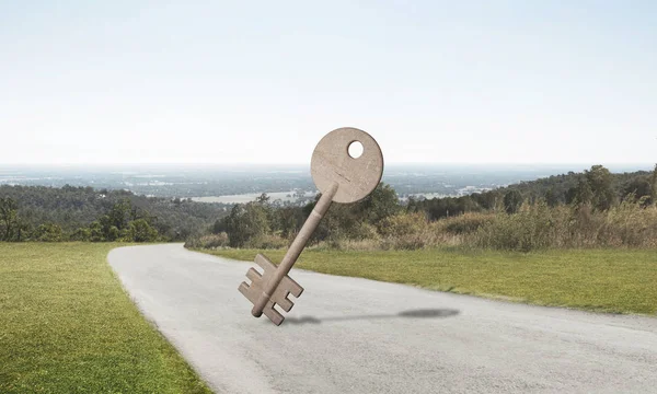 Conceptual background image of concrete key sign on asphalt road — Stock Photo, Image