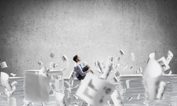 Thoughtful Businessman Looking Away While Sitting Flying Documents Grey Background — Stock Photo, Image