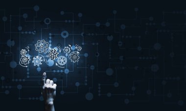 İş adamının eli dişli mekanizmasını işaret ediyor.