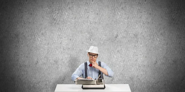 Young Man Writer Hat Eyeglasses Using Typing Machine While Sitting — Stock Photo, Image