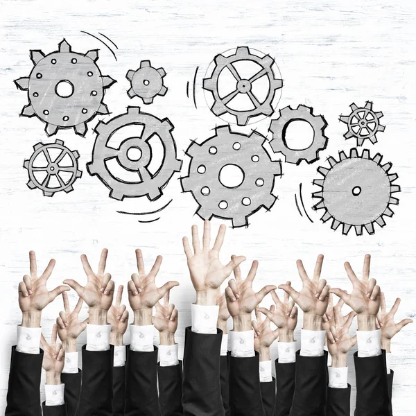 Group of hands of businesspeople showing gestures on wooden background