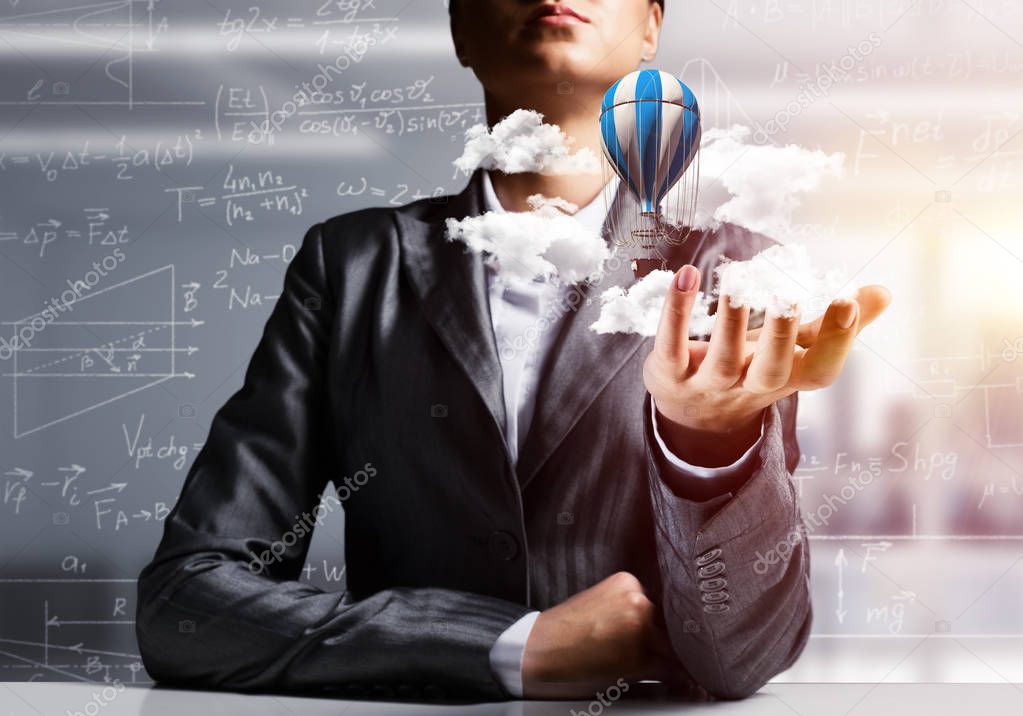 Closeup of business woman in suit presenting flying aerostate among clouds in her palm with business sketches on background. 3D rendering.