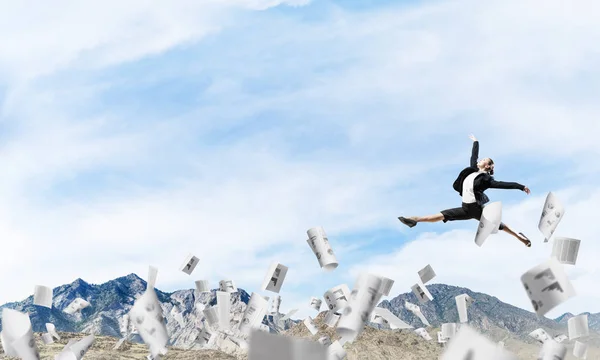 Attractive business woman in suit jumping in the air among flying papers as symbol of active life position. Skyscape and nature view on background. 3D rendering.