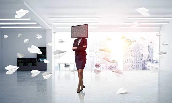 Business woman in suit with TV instead of head keeping arms crossed while standing among flying paper planes inside office building. 3D rendering.