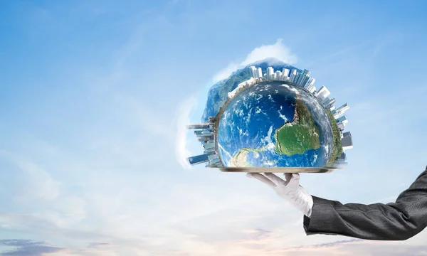 Cropped image of waitress\'s hand in white glove presenting Earth globe on metal tray with cloudy skyscape on background. 3D rendering. Elements of this image are furnished by NASA.