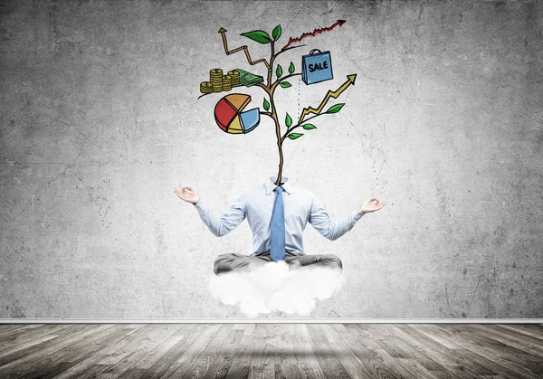 Businessman in lotus pose with lamp head meditating on cloud