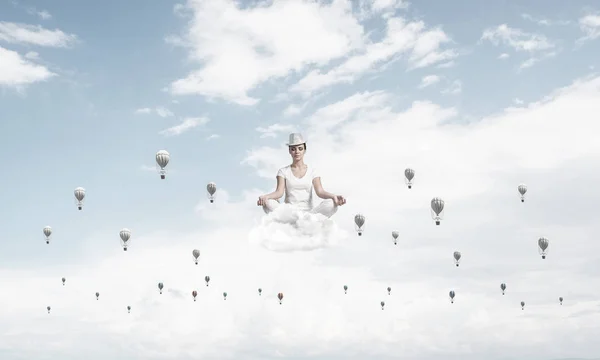 Woman White Clothing Keeping Eyes Closed Looking Concentrated While Meditating — Stock Photo, Image