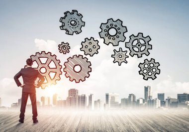 Modern şehre bakan ve vites düzeneği çizen işadamlarının arka planı