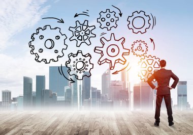 Modern şehre bakan ve vites düzeneği çizen işadamlarının arka planı