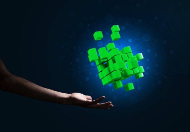 Yeniliğin sembolü olarak insan eli küp figürüne yakın olmak. Karışık ortam.