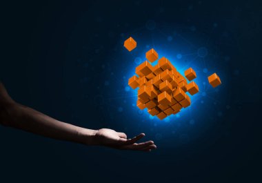 Yeniliğin sembolü olarak insan eli küp figürüne yakın olmak. Karışık ortam.