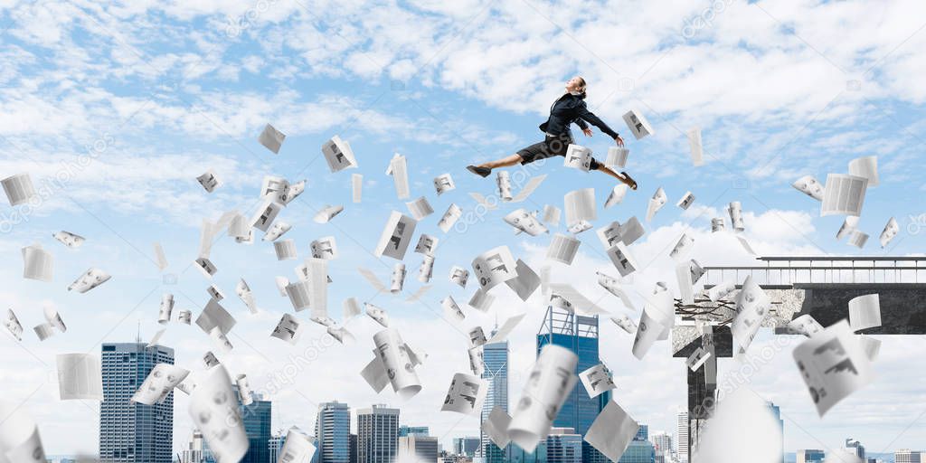 Business woman jumping over gap with flying paper documents in concrete bridge as symbol of overcoming challenges. Cityscape on background. 3D rendering.
