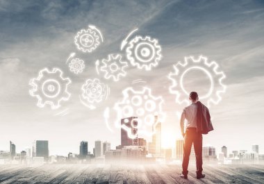 Modern şehre bakan ve vites düzeneği çizen işadamlarının arka planı