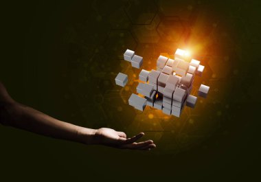 Yeniliğin sembolü olarak insan eli küp figürüne yakın olmak. Karışık ortam.