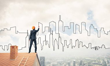 Mühendis, evinin çatısına geri döndü ve şehri çiziyor. Karışık ortam