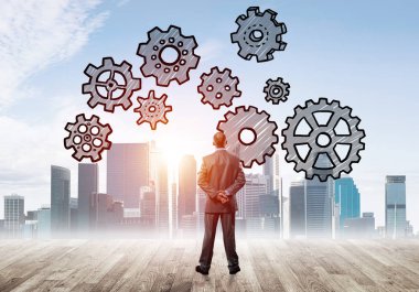 Modern şehre bakan ve vites düzeneği çizen işadamlarının arka planı