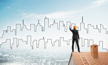 Mühendis, evinin çatısına geri döndü ve şehri çiziyor. Karışık ortam