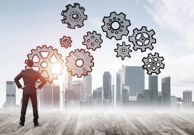 Modern şehre bakan ve vites düzeneği çizen işadamlarının arka planı