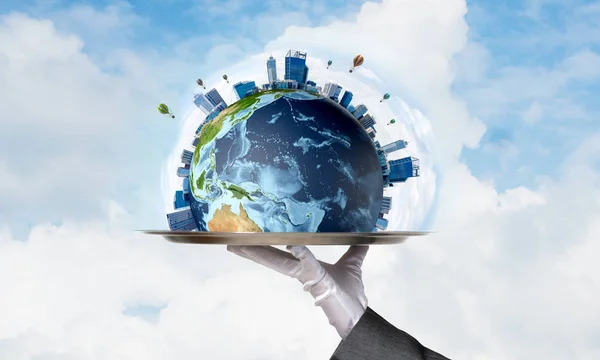 Cropped image of waitress\'s hand in white glove presenting Earth globe on metal tray with cloudy skyscape on background. 3D rendering. Elements of this image are furnished by NASA.