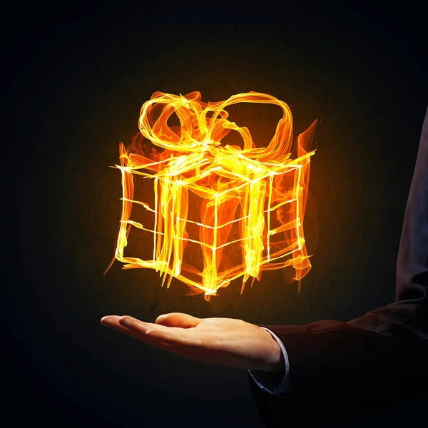 Glowing Fire Gift Box Icon Palm Dark Background — Stock Photo, Image