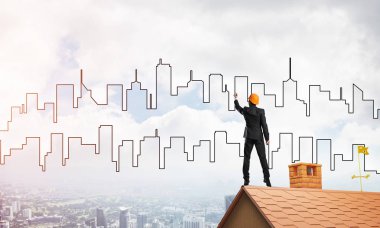 Mühendis, evinin çatısına geri döndü ve şehri çiziyor. Karışık ortam