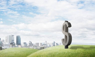 Yeşil tepede taş dolar sembolü para birimi işareti olarak.