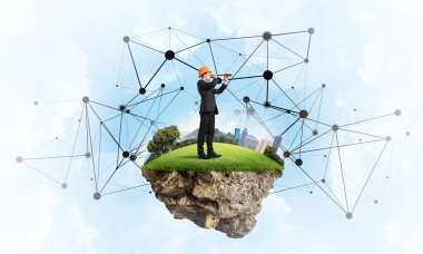 Mavi gökyüzünde yüzen yeşil Adası üzerinde mühendis adam