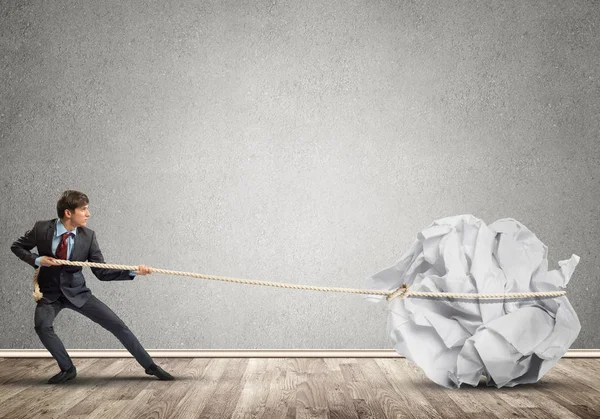 Young Man Making Huge Paper Ball Move — Stock Photo, Image