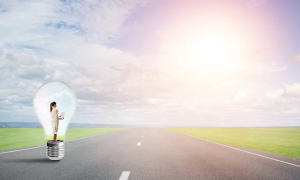 Young Businesswoman Trapped Light Bulb Asphalt Road — Stock Photo, Image