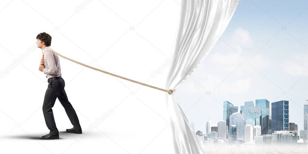 Businessman pulling white blank fabric. Place for text
