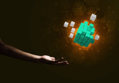 Yeniliğin sembolü olarak insan eli küp figürüne yakın olmak. Karışık ortam.