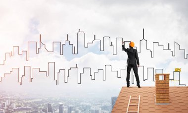 Mühendis, evinin çatısına geri döndü ve şehri çiziyor. Karışık ortam