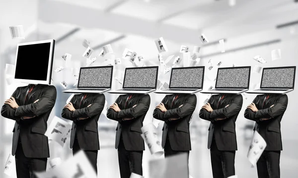 Businessmen Suits Laptops Instead Heads Keeping Arms Crossed While Standing — Stock Photo, Image