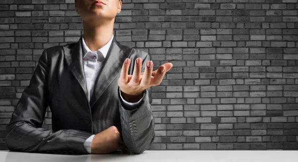 Cropped Image Businessman Black Suit Presenting Empty Palm Gray Brick — Stock Photo, Image