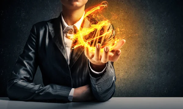Close Businessman Suit Presenting Flaming Euro Sign His Hand Dark — Stock Photo, Image