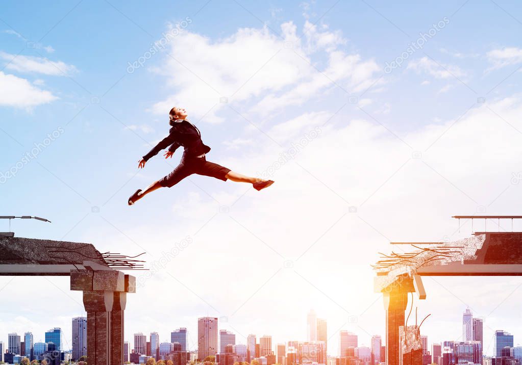 Business woman jumping over gap in concrete bridge as symbol of overcoming challenges. Cityscape with sunlight on background. 3D rendering.
