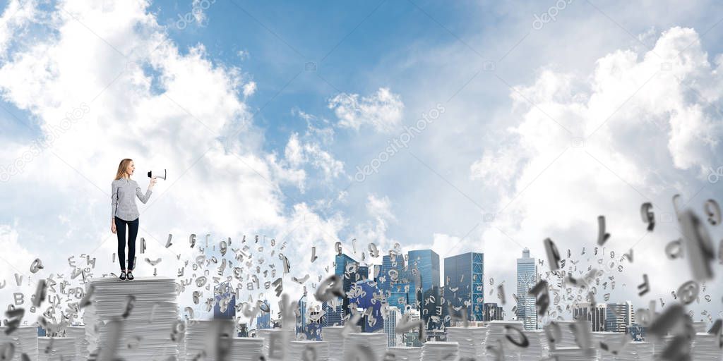 Woman in casual clothing standing among flying letters with speaker in hand and with skyscape on background. Mixed media.