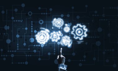 İş adamının eli dişli mekanizmasını işaret ediyor.