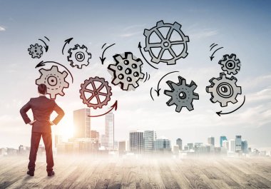 Modern şehre bakan ve vites düzeneği çizen işadamlarının arka planı