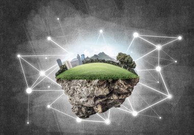 Beton zemin üzerinde çimen ve şehir manzarası olan güzel küçük bir ada.