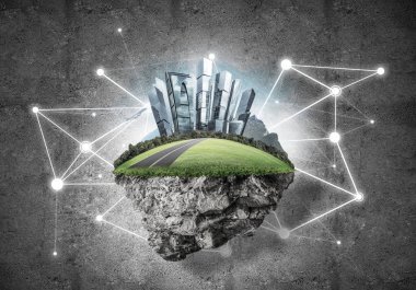 Beton zemin üzerinde çimen ve şehir manzarası olan güzel küçük bir ada.