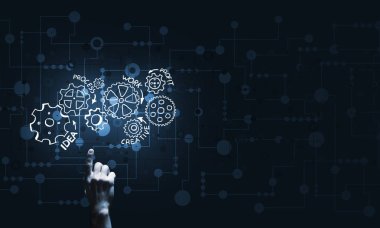 İş adamının eli dişli mekanizmasını işaret ediyor.