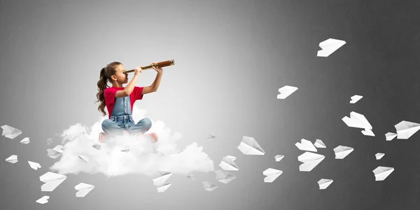 Cute Kid Girl Sitting Cloud Looking Spyglass Paper Planes Flying — Stock Photo, Image