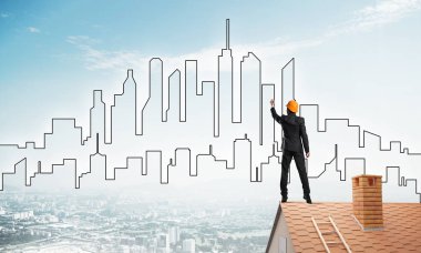 Mühendis, evinin çatısına geri döndü ve şehri çiziyor. Karışık ortam