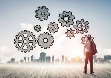 Modern şehre bakan ve vites düzeneği çizen işadamlarının arka planı