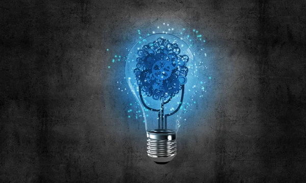 Glowing glass lightbulb with multiple gears inside with dark grey wall on background. 3D rendering.