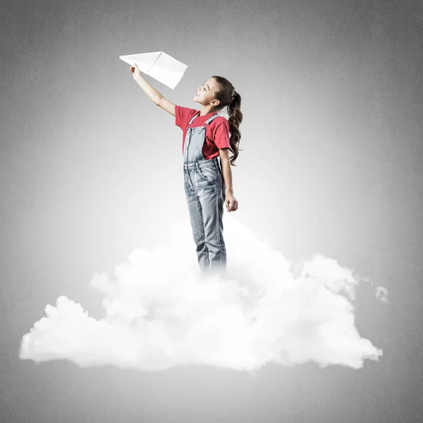 Cute Kid Girl Standing Cloud Throwing Paper Plane — Stock Photo, Image