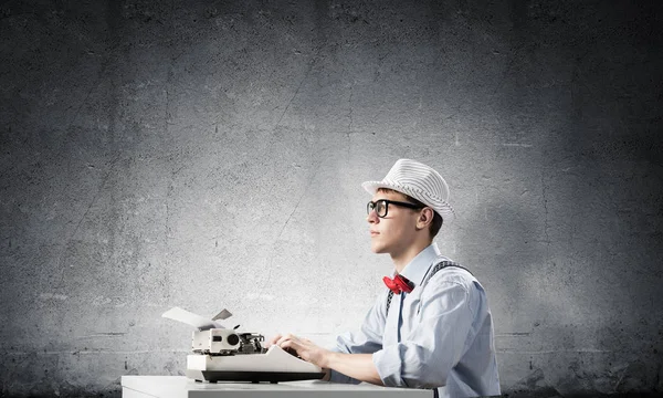 Young Man Writer Hat Eyeglasses Using Typing Machine While Sitting — Stock Photo, Image